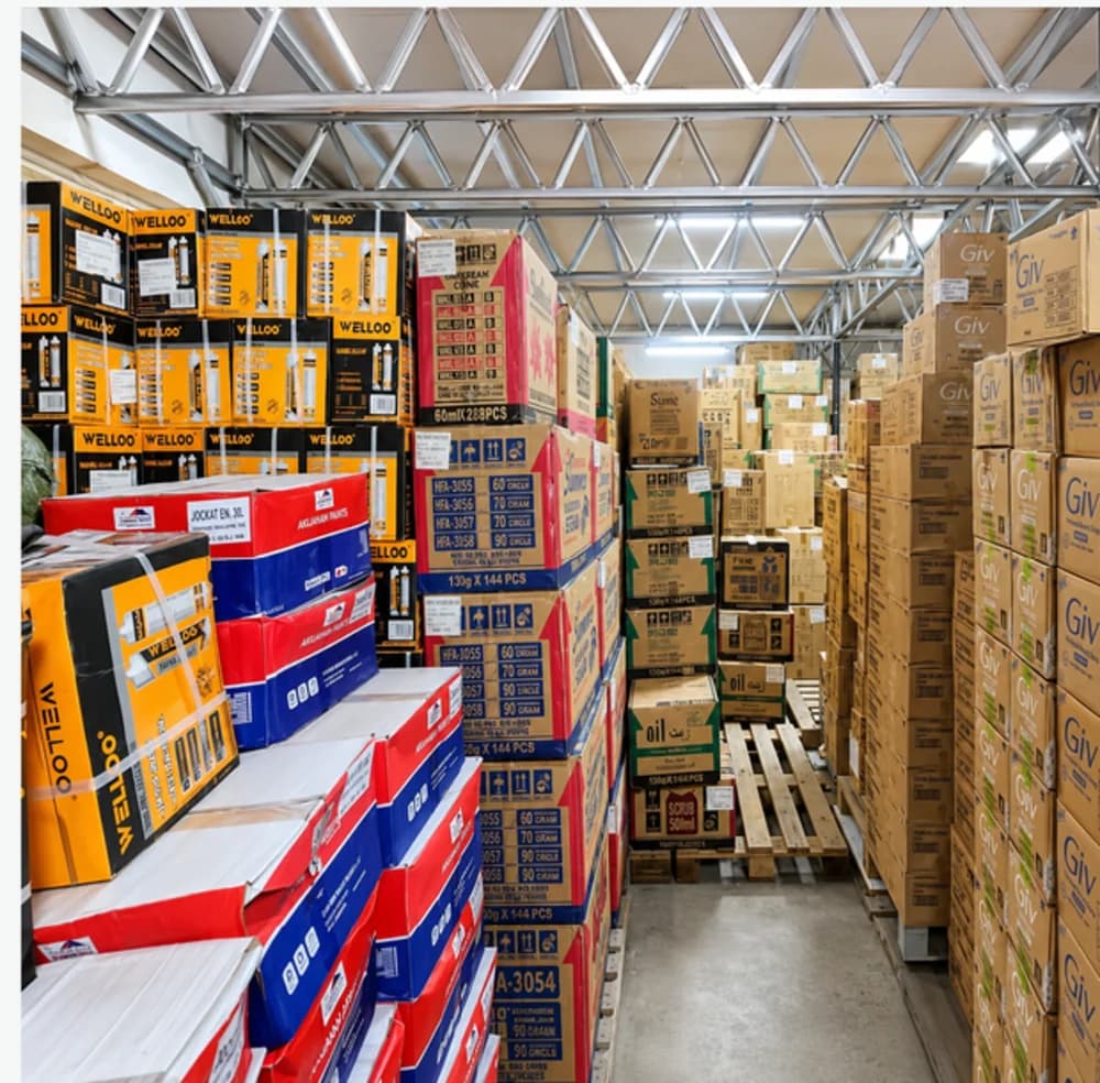 Bulk cartons stacked to the roof in a Brotherhood Group storage warehouse